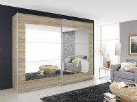 click to see larger image of This stunning 226cm wide x 210cm high sliding door wardrobe comes with 1 shelf and 1 rail in each of the extra wide compartments. Shown in stock for prompt delivery in Sonoma Oak colour. Available to order in other colours. FREE DELIVERY AND ASSEMBLY IN OUR AREA BY TRAINED STAFF. FAMILY SERVICE FROM A LOCAL BUSINESS.